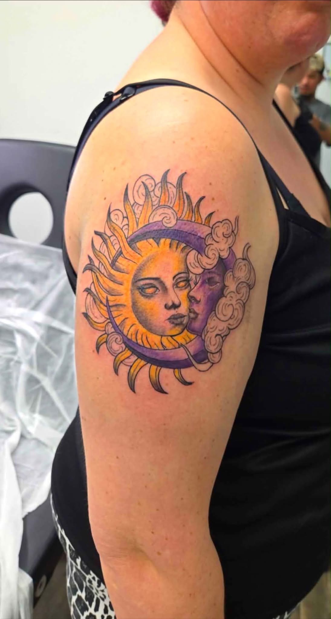 Sun and moon color tattoo on shoulder